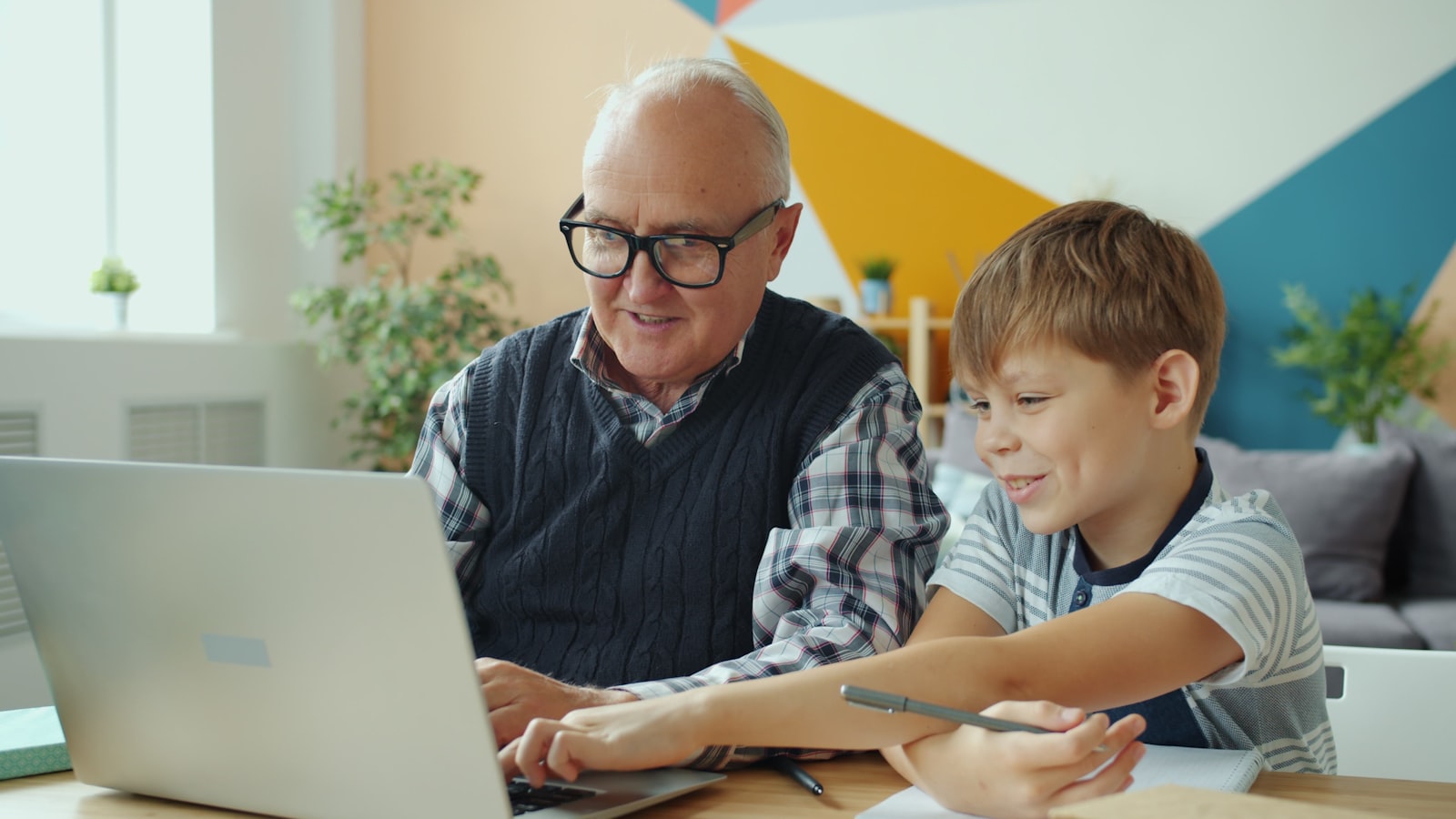 Family enrolling in coverage together at a laptop